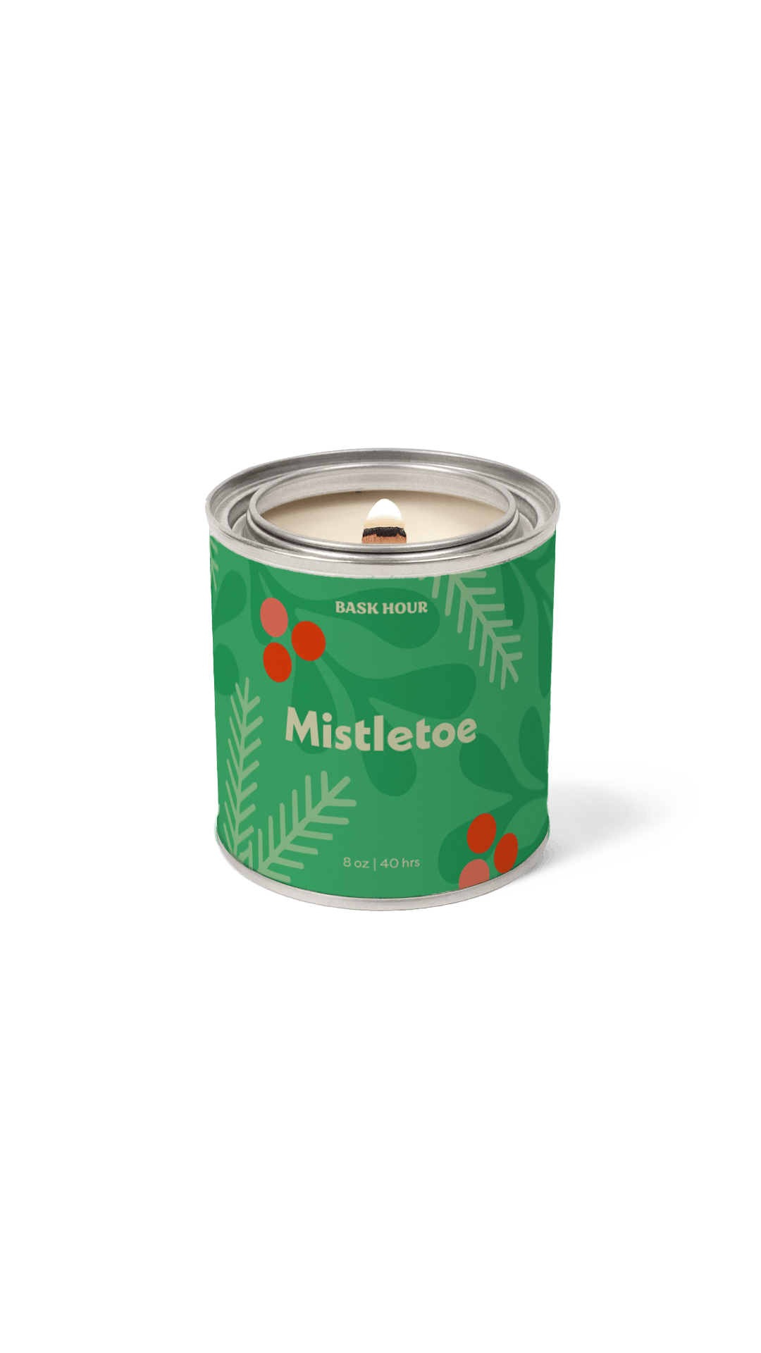 Candle in a green container labeled 'Mistletoe' on a green background