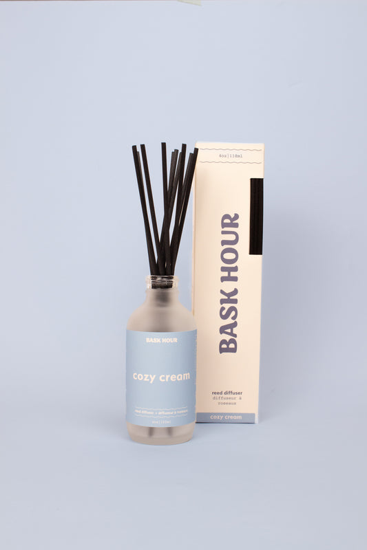 Cozy Cream reed diffuser with a blend of citrus, vanilla, and musk, providing a warm and inviting fragrance that lasts for weeks.