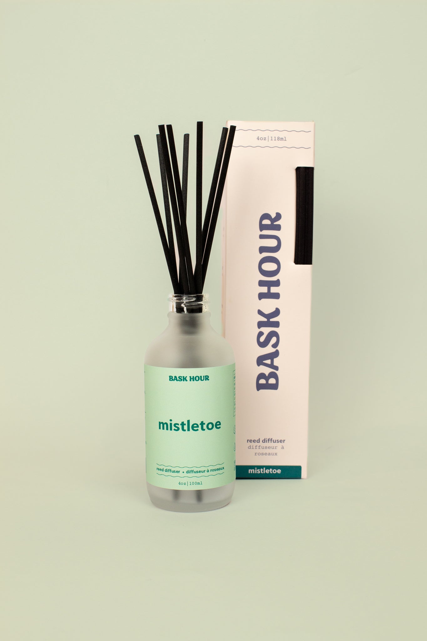 Mistletoe reed diffuser with fresh, woodsy fragrance perfect for the holiday season, offering long-lasting scent and a minimalist design.